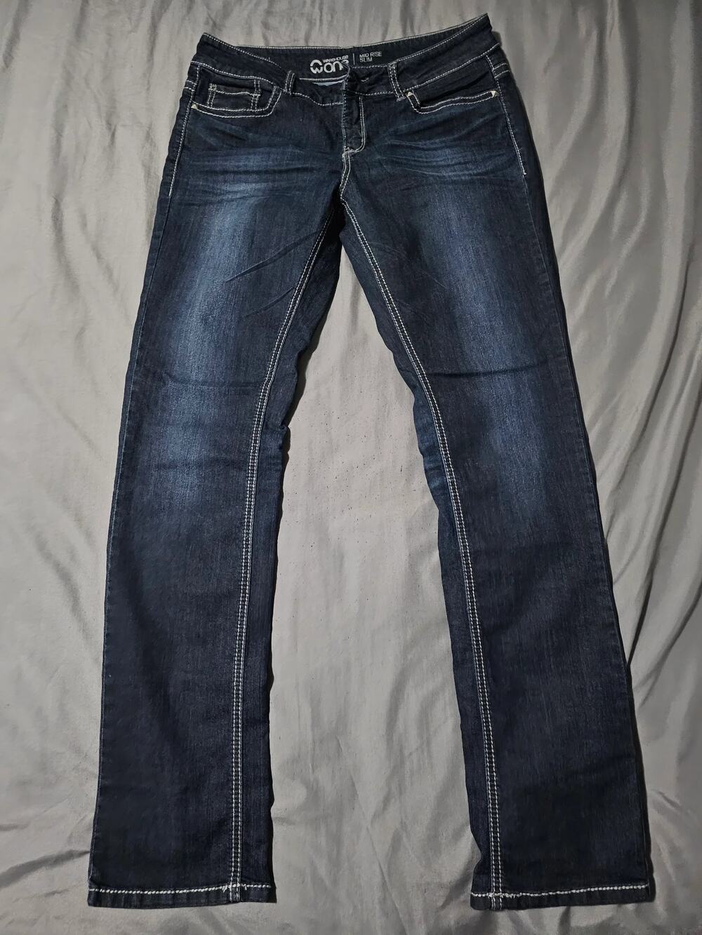 Dark wash denim jeans with contrast stitching